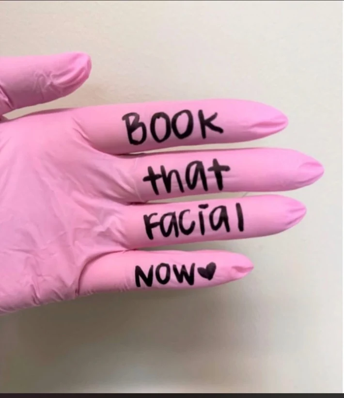 Pink glove with a handwritten reminder to book a facial